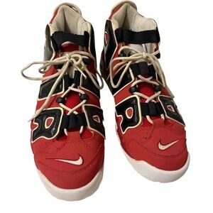 This is a pair of Nike Air More Uptempo
'96 basketball shoes in a red, black.